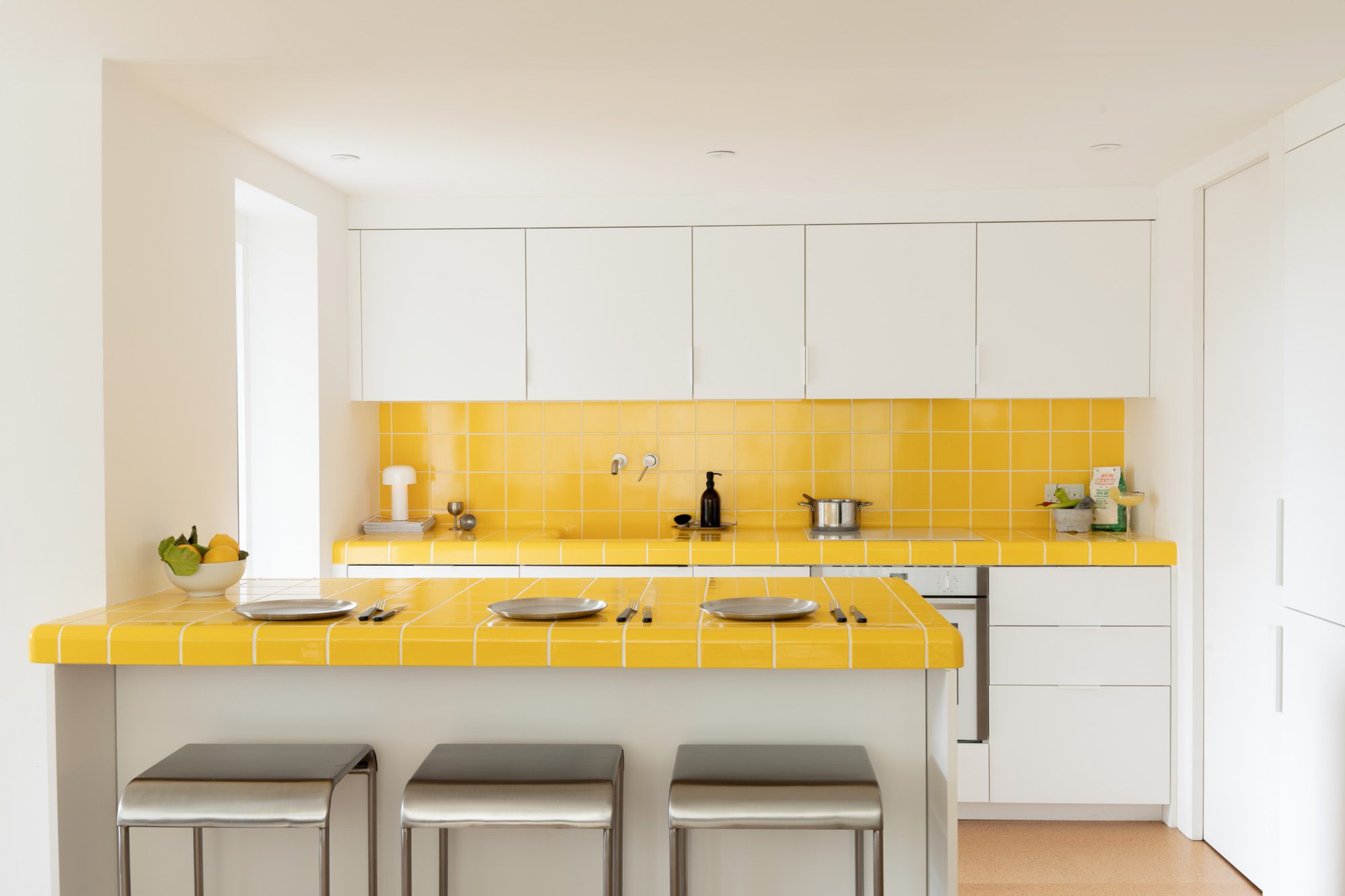 HUSK's Westmoreland Road Kitchen, featuring FENIX® Fronts in Bianco Kos and Yellow DTile® Curved Tiles