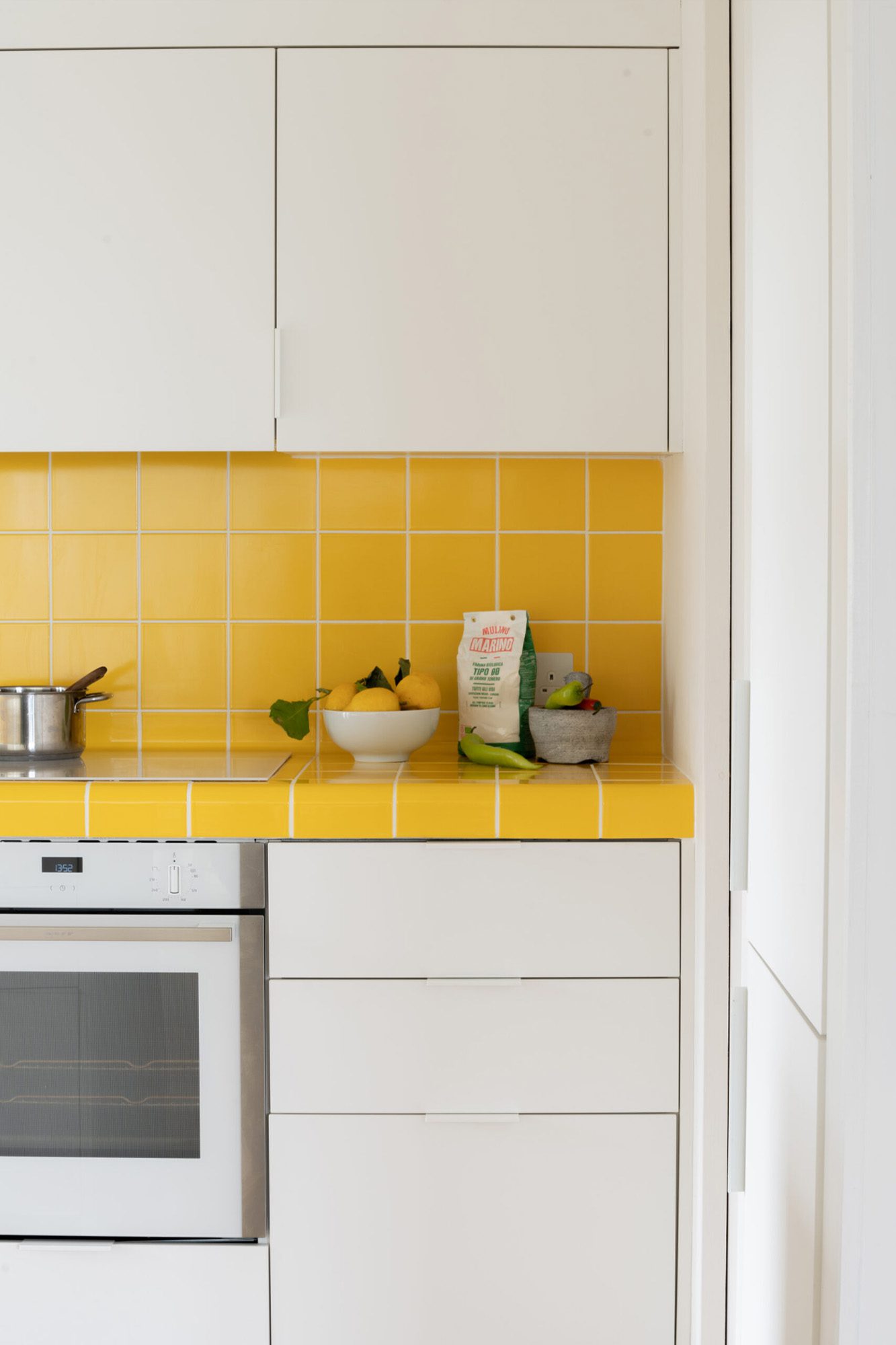 HUSK's Westmoreland Road Kitchen, featuring FENIX® Fronts in Bianco Kos and Yellow DTile® Curved Tiles