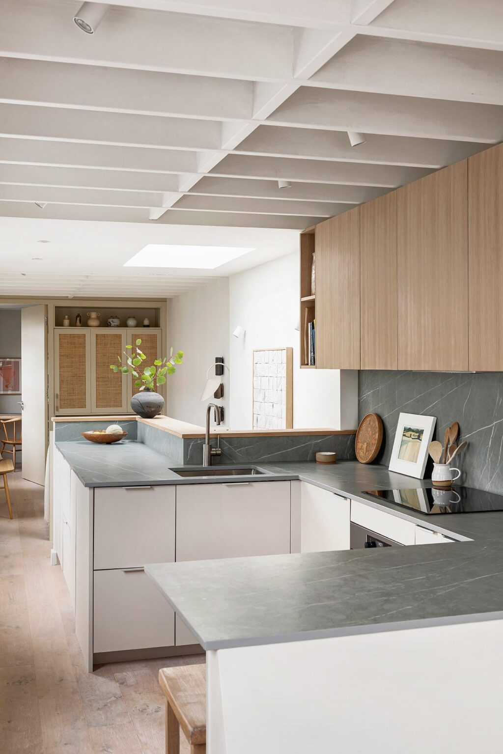 Compact open-plan kitchen layout with bespoke cabinetry made by HUSK