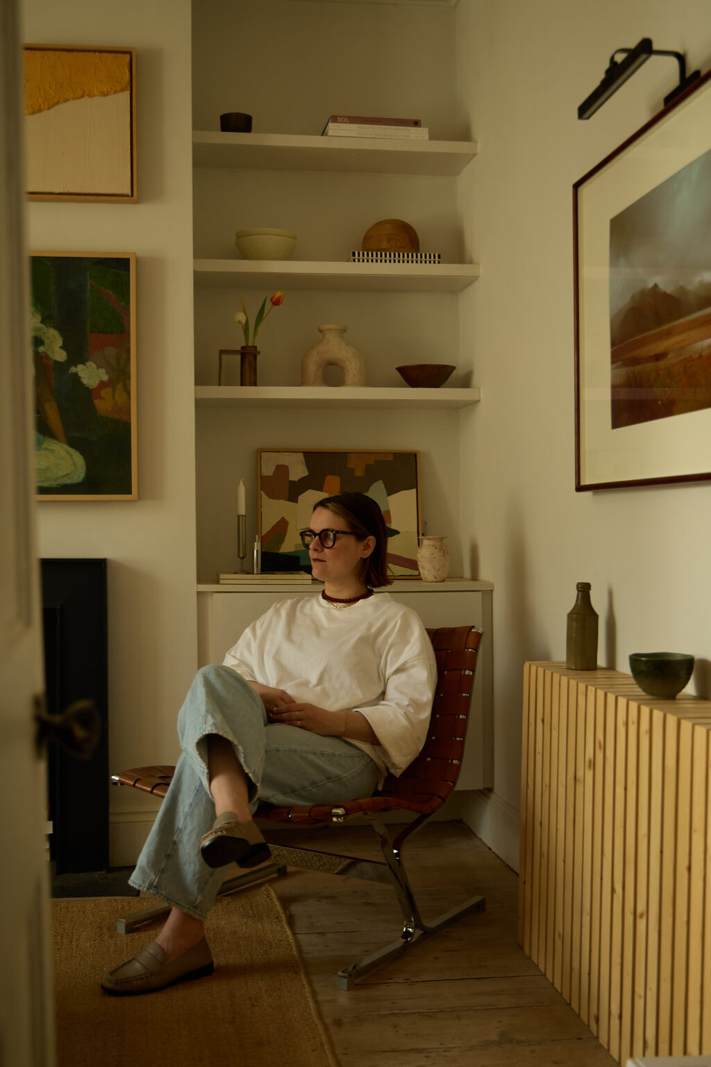 Portrait of artist & interior designer Rosa Roig-Fiol sitting in her living room