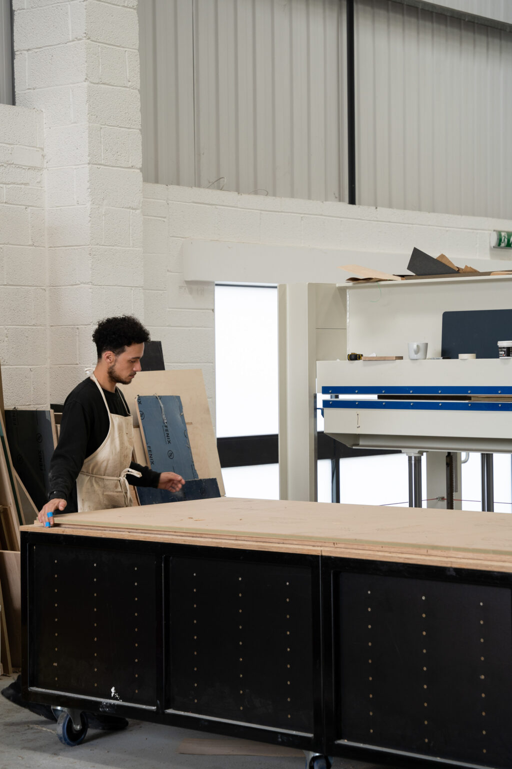 HUSK workshop preparing ply board for press