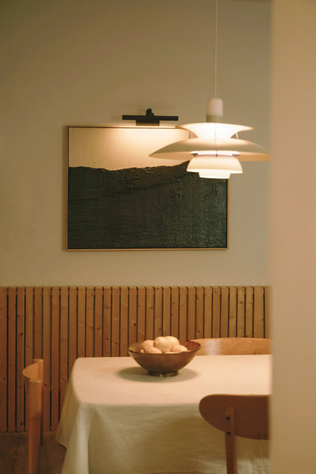 Contemporary dining room featuring abstract artwork by Rosa Roig-Fiol