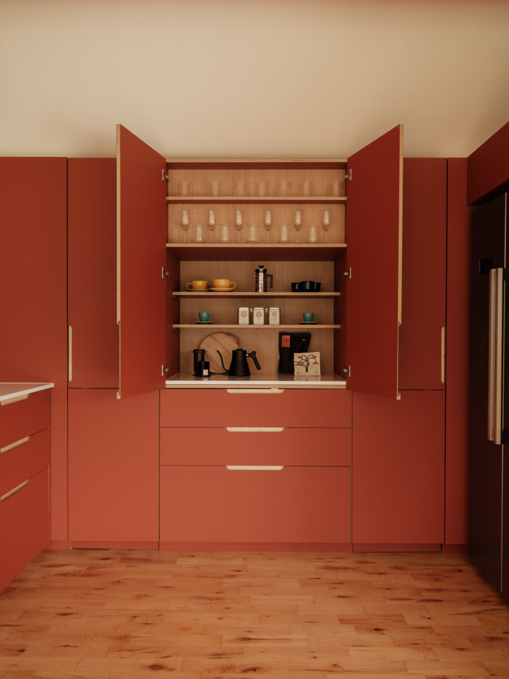 Double cabinet doors opened to reveal internal shelving with glassware, cups, and coffee-making equipment.