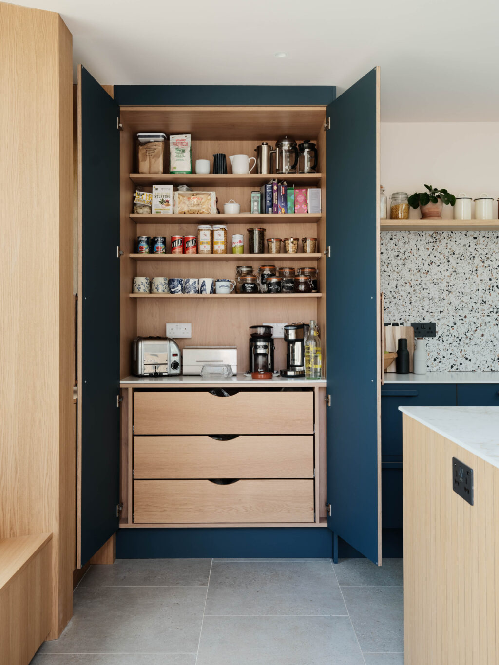 Bespoke breakfast pantry with FENIX Blu Shaba doors, oak interior shelving, integrated drawers and dedicated small appliance storage.