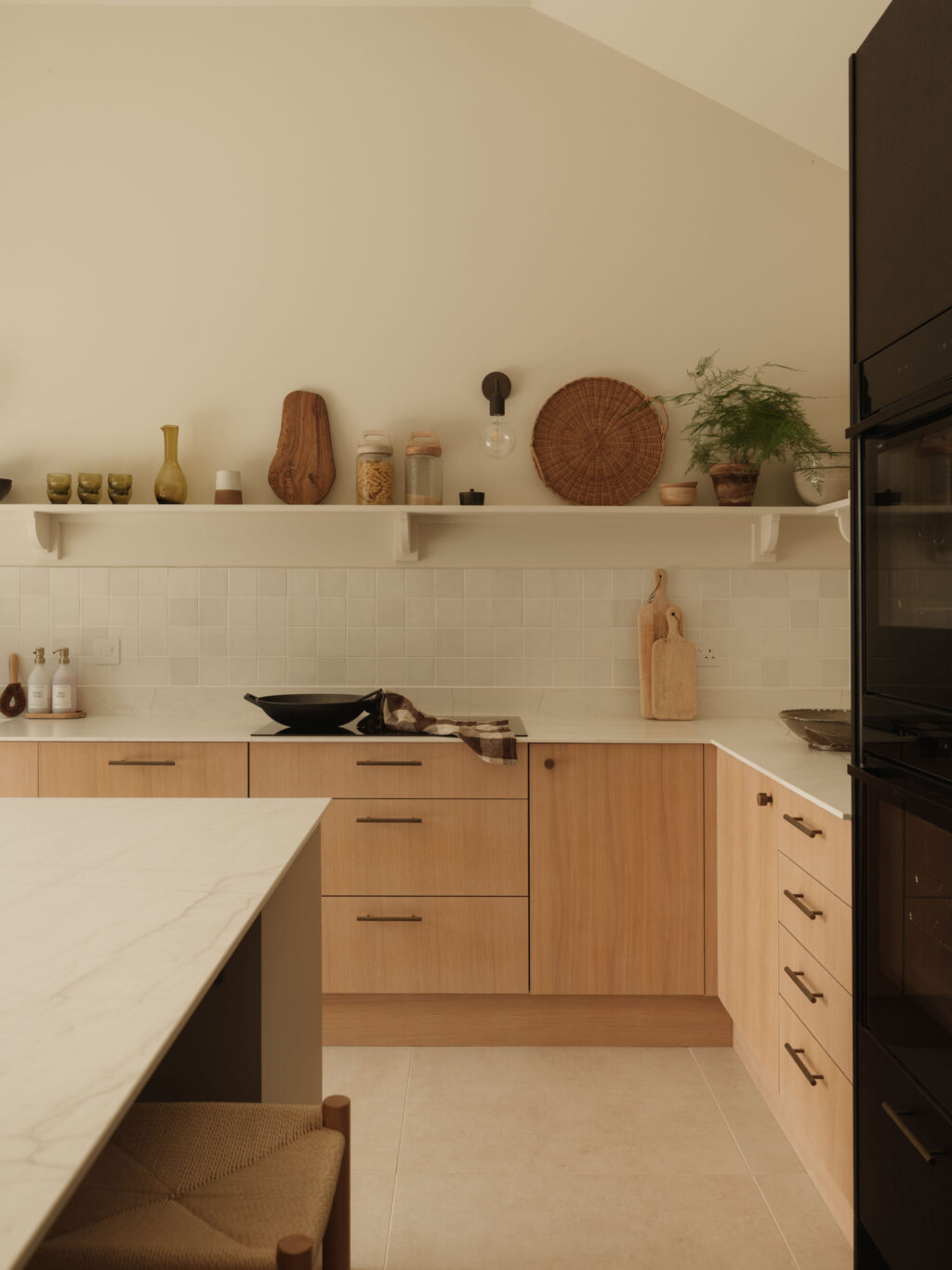 Contemporary kitchen with FENIX Beige Arizona island, smoked oak tall cabinets and White Tint Oak timber veneer cabinetry.