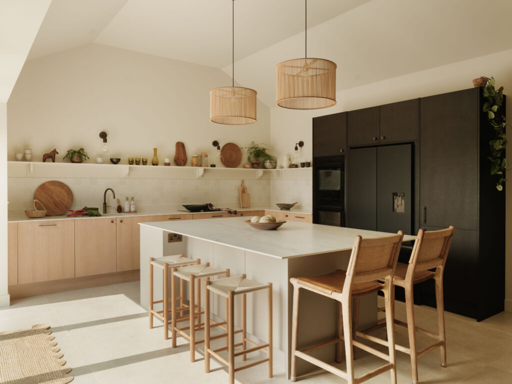 Contemporary kitchen with Neolith Mont Blanc island, White Tint Oak timber veneer cabinetry, smoked oak tall units and Fisher & Paykel appliances.
